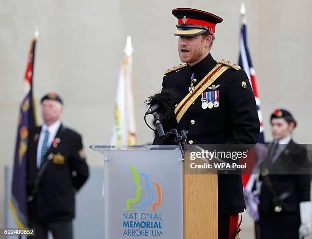 Prince Harry speaks after laying a wreath on the Armed Forces Memorial during Armistice Day commemorations at the National Memorial Arboretum on...