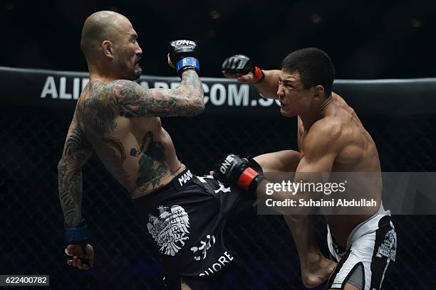 Timofey Nastyukhin of Russia fights Kotetsu Boku of Japan for the men's featherweight bout during One Championship: Defending Honor at Singapore...