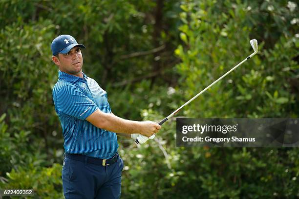 Gary Woodland of the United States watches his shot from the 17th tee during the second round of the OHL Classic at Mayakoba on November 11, 2016 in...