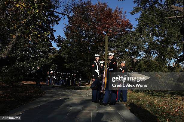 Marine honor guards wait to participate in a wreath-laying ceremony at the Tomb of the Unknown Soldier at Arlington National Cemetery on Veterans Day...