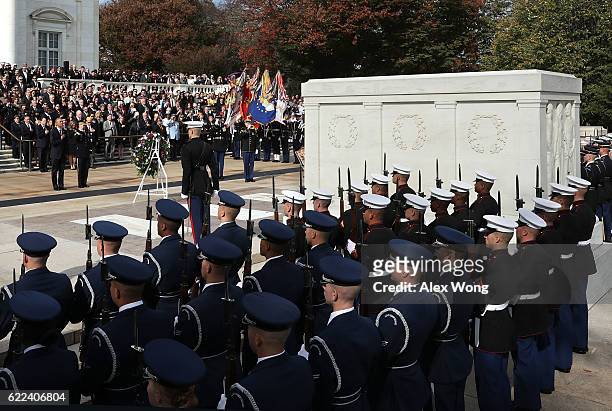 President Barack Obama participates in a wreath-laying ceremony at the Tomb of the Unknown Soldier at Arlington National Cemetery on Veterans Day...