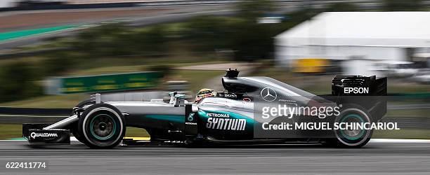 Mercedes' AMG Petronas F1 Team British driver Lewis Hamilton, drives his car during the second practice session of the Formula One Brazilian Grand...