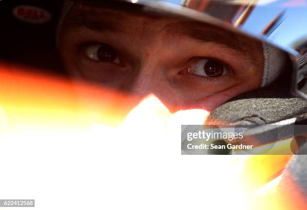 Daniel Suarez, driver of the ARRIS Toyota, sits in his car during practice for the NASCAR XFINITY Series Ticket Galaxy 200 at Phoenix International...