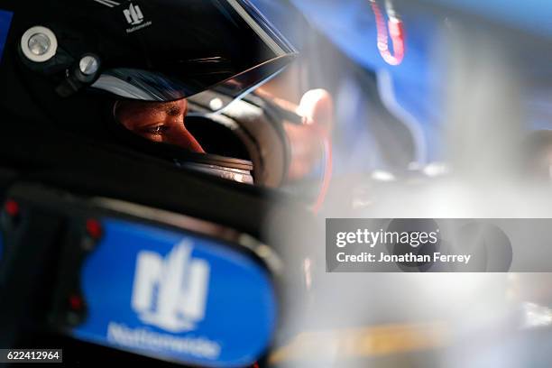 Alex Bowman, driver of the Nationwide Chevrolet, sits in his car during practice for the NASCAR Sprint Cup Series Can-Am 500 at Phoenix International...