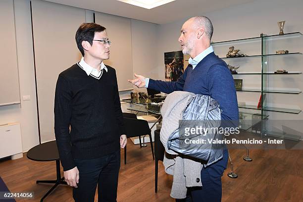 Jun Liu and FC Internazionale head coach Stefano Pioli talk after the visits Brook Brothers Store on November 11, 2016 in Milan, Italy.