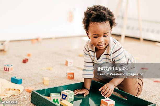 organizing toddlers toys - baby blocks stock pictures, royalty-free photos & images