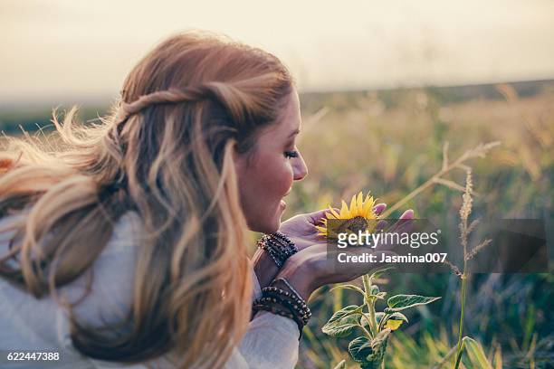 beautiful womanl with sunflower outdoors - flower woman stockfoto's en -beelden