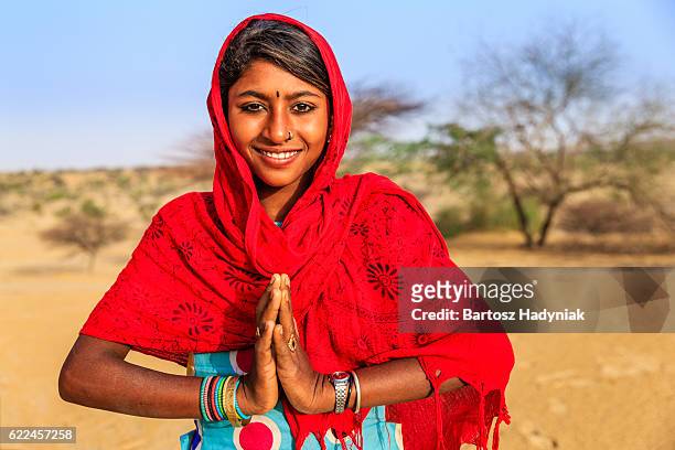 namaste! portrait of happy indian girl in desert village, india - namaste bildbanksfoton och bilder