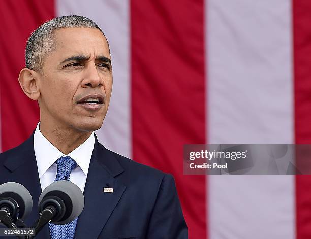 President Barack Obama makes remarks in the Memorial Amphitheater on Veterans Day after laying a wreath at the Tomb of the Unknown Soldier at...