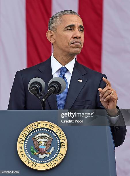 President Barack Obama makes remarks in the Memorial Amphitheater on Veterans Day after laying a wreath at the Tomb of the Unknown Soldier at...