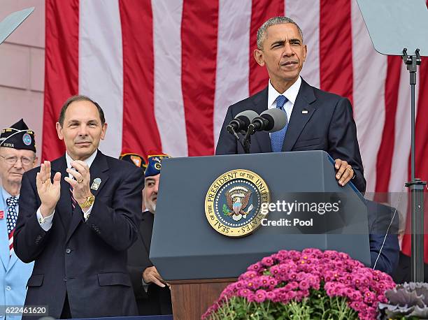 President Barack Obama makes remarks in the Memorial Amphitheater on Veterans Day after laying a wreath at the Tomb of the Unknown Soldier at...