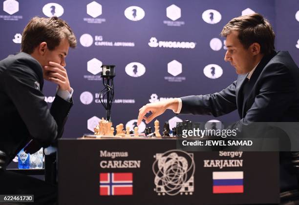 Chess grandmaster and current world chess champion Magnus Carlsen of Norway looks as challenger Sergey Karjakin of Russia makes a move during their...