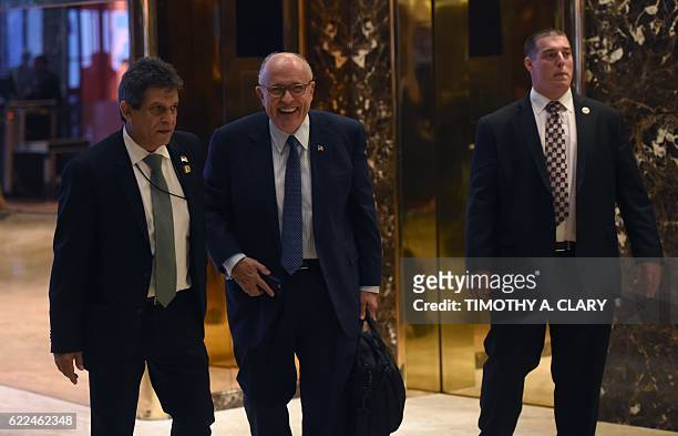 Former New York City mayor Rudy Giuliani leaves Trump Tower as President-elect Donald Trump holds meetings in his office at Trump Tower on 5th Avenue...