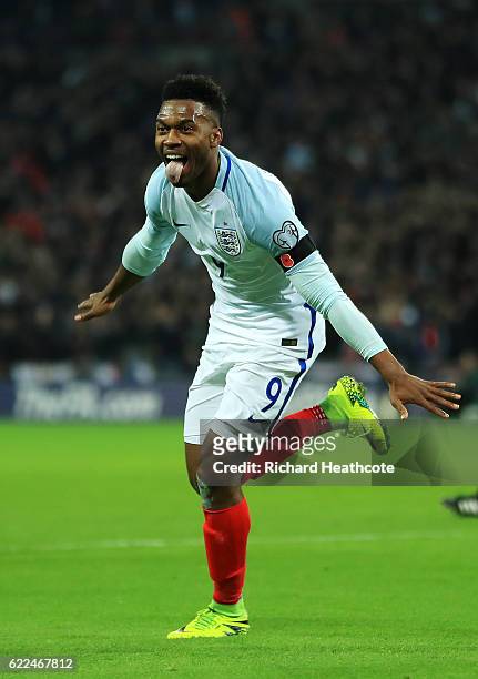 Daniel Sturridge of England celebrates as he scores their first goal during the FIFA 2018 World Cup qualifying match between England and Scotland at...
