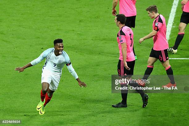 Daniel Sturridge of England celebrates scoring the opening goal during the FIFA 2018 World Cup Qualifier between England and Scotland at Wembley...