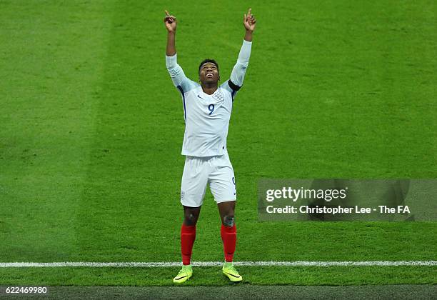 Daniel Sturridge of England celebrates scoring the opening goal during the FIFA 2018 World Cup Qualifier between England and Scotland at Wembley...