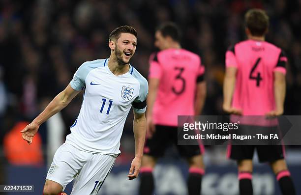 Adam Lallana of England celebrates scoring his team's second goal during the FIFA 2018 World Cup Qualifier between England and Scotland at Wembley...
