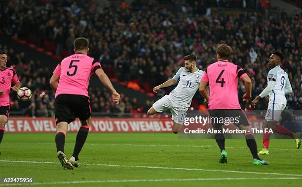 Adam Lallana of England heads the ball to score his team's second goal during the FIFA 2018 World Cup Qualifier between England and Scotland at...