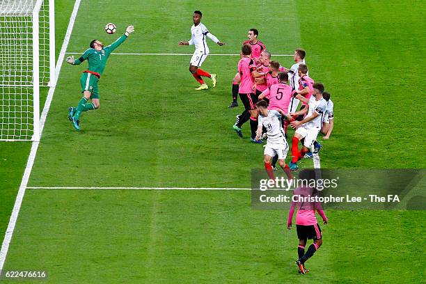 Gary Cahill of England heads the ball to score his team's third goal during the FIFA 2018 World Cup Qualifier between England and Scotland at Wembley...