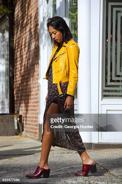 Tina Maria Tran with Urban Decay red lipstick wearing yellow pleather leather biker jacket with zips from Zara, red and black sheer floral midi dress...