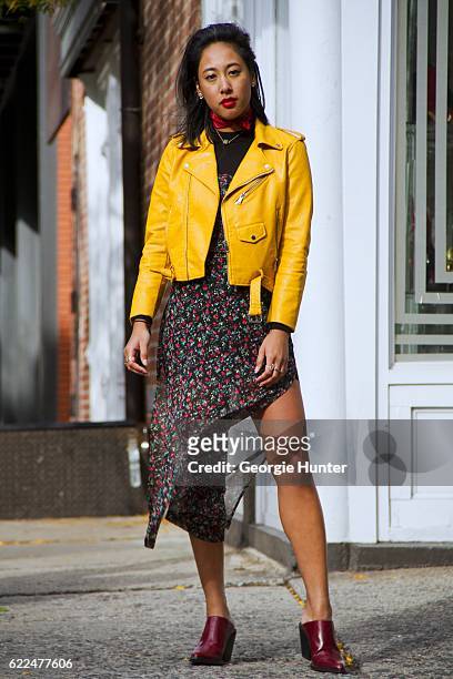 Tina Maria Tran with Urban Decay red lipstick wearing yellow pleather leather biker jacket with zips from Zara, red and black sheer floral midi dress...