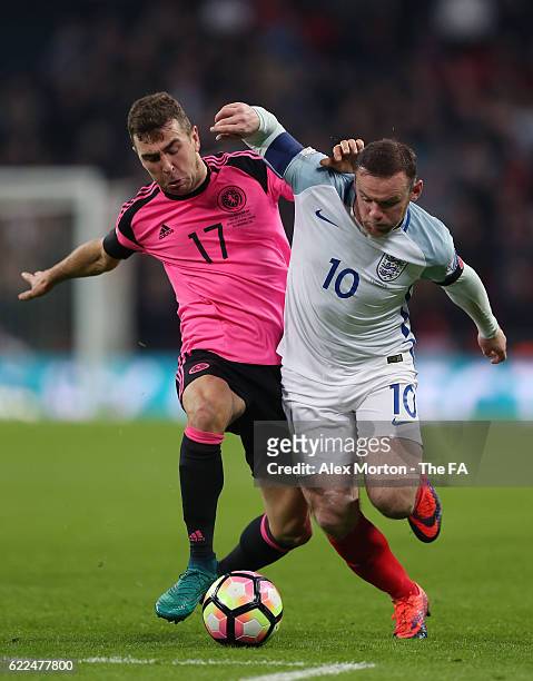 Wayne Rooney of England and James McArthur of Scotland compete for the ball during the FIFA 2018 World Cup Qualifier between England and Scotland at...