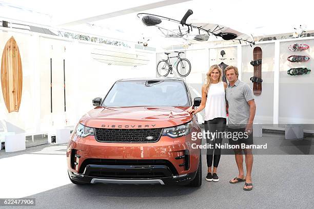 Big-wave surfer, Laird Hamilton, and champion volleyball player and fitness leader, Gabby Reece, with the all-new Land Rover Discovery SUV at the...