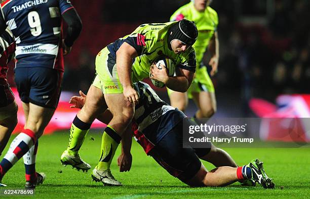 James Flynn of Sale Sharks is tackled by Marc Jones of Bristol Rugby during the Anglo-Welsh Cup match between Bristol Rugby and Sale Sharks at Ashton...