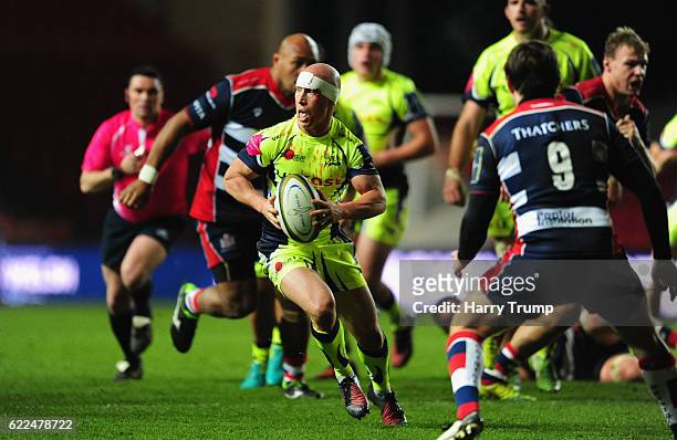 Peter Stringer of Sale Sharks looks to break past Rhodri Williams of Bristol Rugby during the Anglo-Welsh Cup match between Bristol Rugby and Sale...