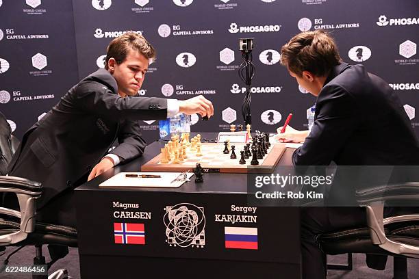 Reigning Chess Champion Magnus Carlsen and Chess grandmaster Sergey Karjakin start the game during 2016 World Chess Championship at Fulton Market...