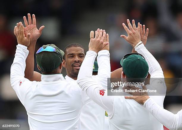 Vernon Philander of South Africa celebrates after taking the wicket of David Warner of Australia during day one of the Second Test match between...