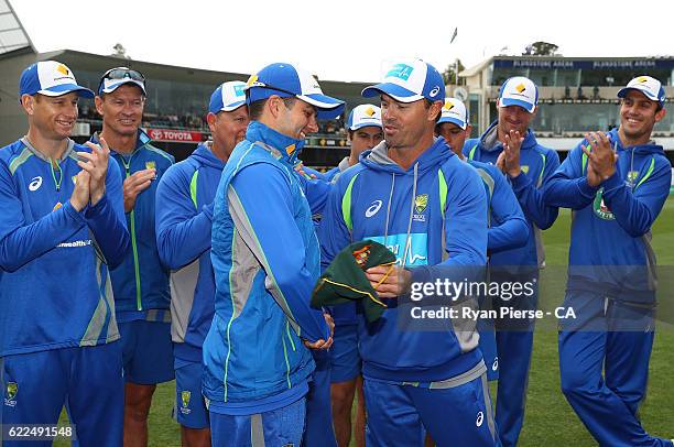 Callum Ferguson of Australia is presented his Baggy Green Cap by former Australian Test player Greg Blewett during day one of the Second Test match...