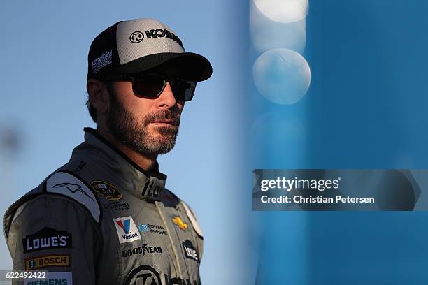 Jimmie Johnson, driver of the Kobalt Chevrolet, stands on the grid during qualifying for the NASCAR Sprint Cup Series Can-Am 500 at Phoenix...