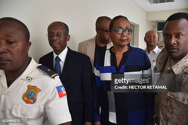 Former haitian president, Jean Bertrand Aristide and Presidential candidate Maryse Narcisse arrive at the headquarters of the Provisional Electoral...