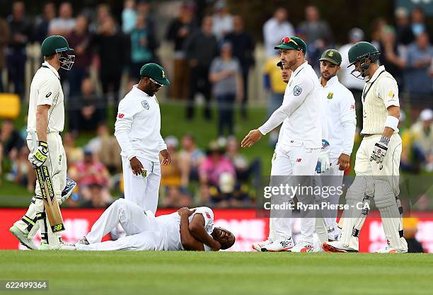 Steve Smith of Australia speaks with Faf du Plessis of South Africa after he collided with Vernon Philander of South Africa during day one of the...