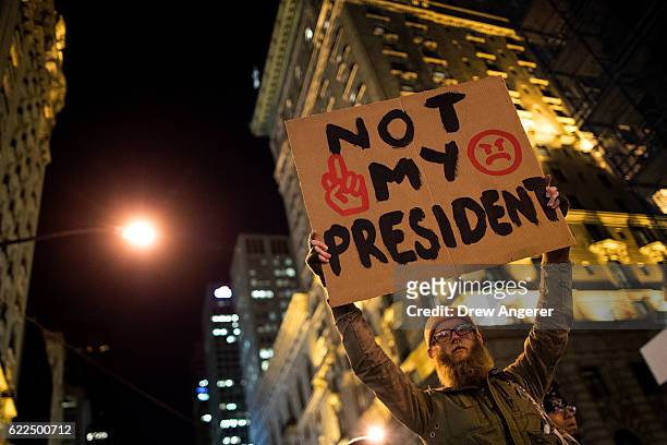 Anti-Donald Trump protesters march in the street on Fifth Avenue, November 11, 2016 in New York City. The election of Trump as president has sparked...