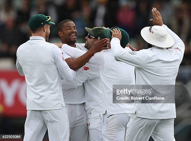 Vernon Philander of South Africa celebrates after taking the wicket of Adam Voges of Australia during day one of the Second Test match between...