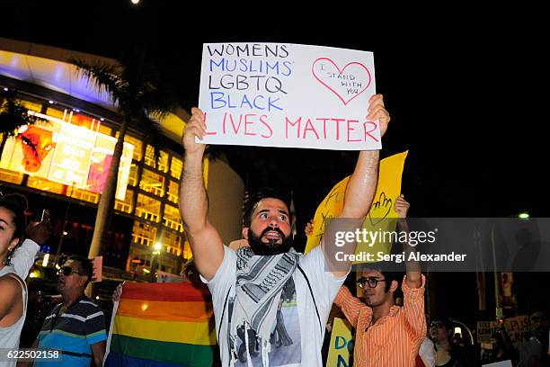 Protester marches at the anti-Trump protest in downtown Miami on November 11, 2016 in Miami, Florida.