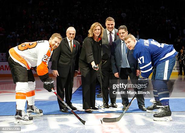 Claude Giroux of the Philadelphia Flyers and Leo Komarov of the Toronto Maple Leafs take the ceremonial face-off with the 2016 Hockey Hall of Fame...