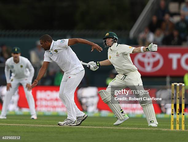 Steve Smith of Australia collides with Vernon Philander of South Africa during day one of the Second Test match between Australia and South Africa at...