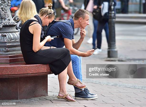 swedish young persons, using mobile smart phones - stureplan - stureplan bildbanksfoton och bilder