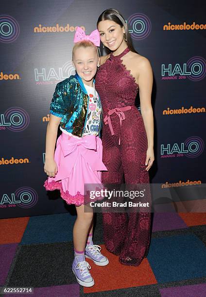 JoJo Siwa and Kira Kosarin pose backstage during the 2016 Nickelodeon HALO awards at Basketball City - Pier 36 - South Street on November 11, 2016 in...