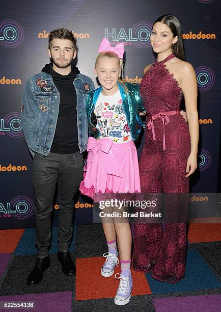 Jack Griffo, JoJo Siwa and Kira Kosarin pose backstage during the 2016 Nickelodeon HALO awards at Basketball City - Pier 36 - South Street on...