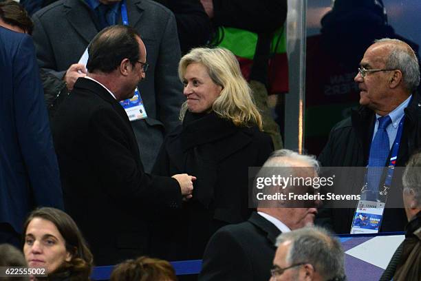 The French president Francois Hollande congratulates Nathalie Boy de la Tour after his election to the presidency of the France football league...