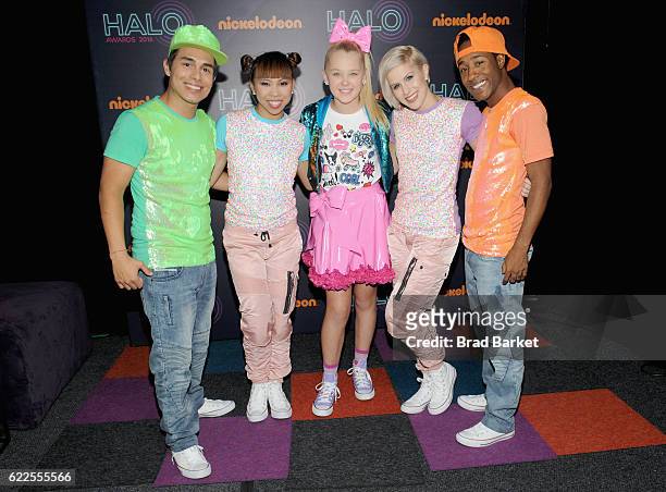 JoJo Siwa poses backstage with dancers during the 2016 Nickelodeon HALO awards at Basketball City - Pier 36 - South Street on November 11, 2016 in...