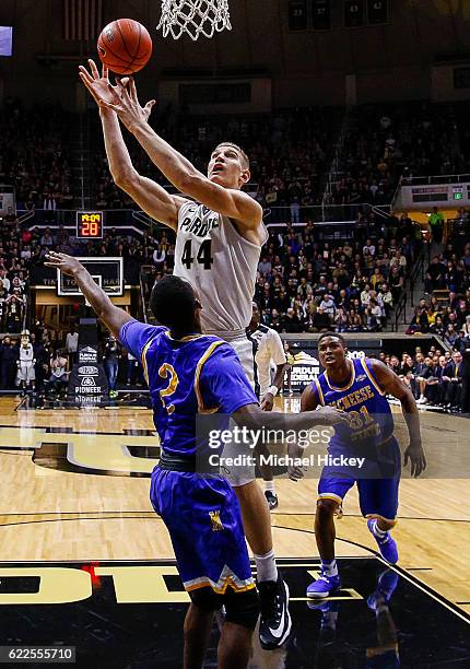 Isaac Haas of the Purdue Boilermakers shoots the ball over James Harvey of the McNeese State Cowboys at Mackey Arena on November 11, 2016 in West...