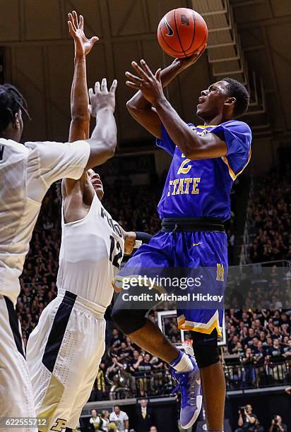 James Harvey of the McNeese State Cowboys shoots the ball against Vince Edwards of the Purdue Boilermakers at Mackey Arena on November 11, 2016 in...