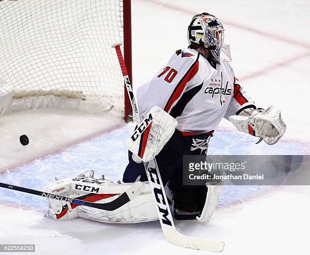 The puck slips past Braden Holtby of the Washington Capitals on a goal by Brian Campbell of the Chicago Blackhawks at the United Center on November...