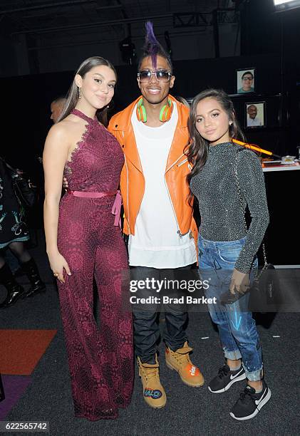 Kira Kosarin, Nick Cannon, and Isabela Moner pose backstage during the 2016 Nickelodeon HALO awards at Basketball City - Pier 36 - South Street on...