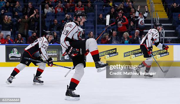 Antoine Waked of the Rouyn-Noranda Huskies celebrates his teammate game tying goal late in the third period against the Quebec Remparts during their...